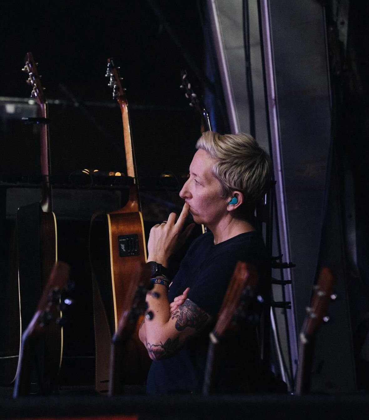 Photo of Claire Murphy looking at a guitar Photo of Claire Murphy looking at a guitar